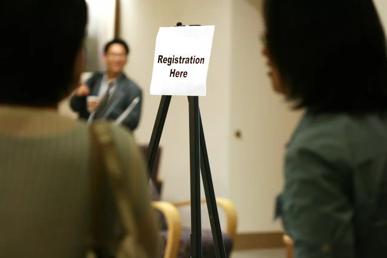 5 Reasons Why You Should Use Company Formations Agents title above sign reading Registration Here with blurred people nearby