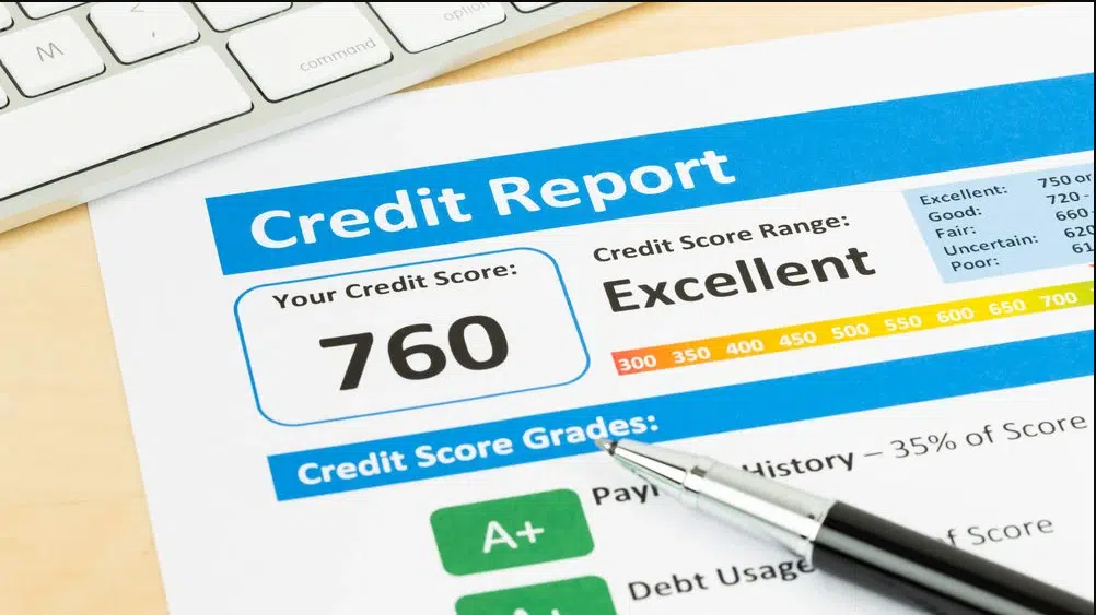 Company credit score UK shown as 760 excellent on a credit report document with a pen and keyboard visible