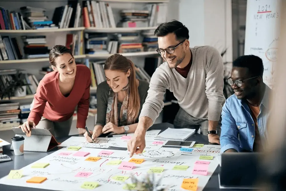 A diverse group of professionals planning a business, representing a foreigner starting a business in the UK