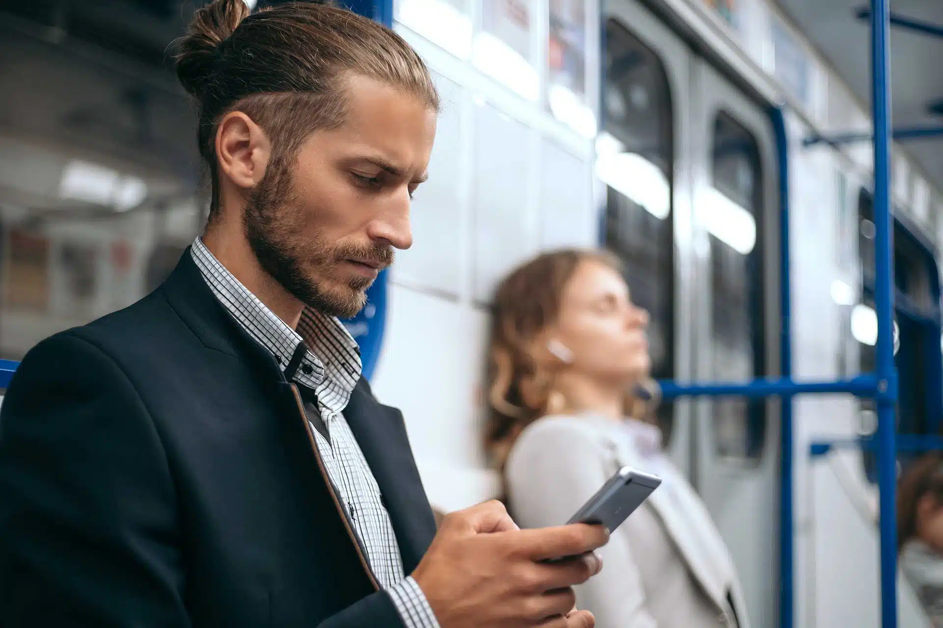 Businessman checking his phone representing a company director reviewing the new Companies House registered office address requirements