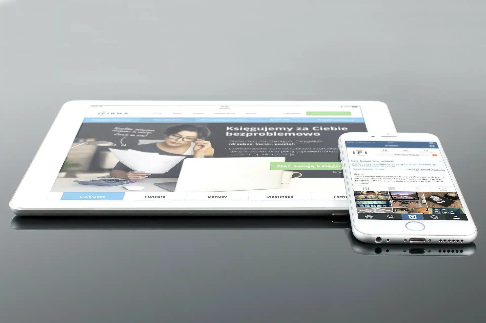 Tablet and smartphone displaying a website layout for starting your website design business guide