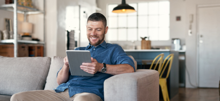 Entrepreneur working on a tablet to register a business online with Your Company Formations